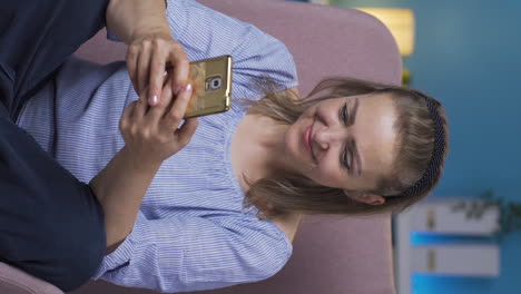 Vertical-video-of-Happy-and-happy-texting-woman.